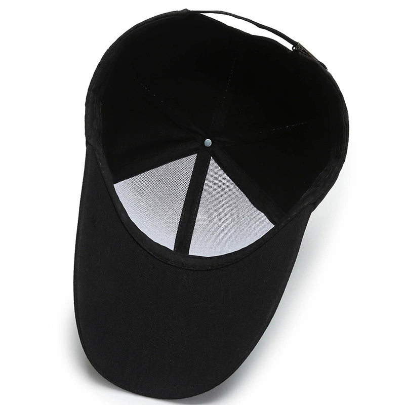 Inside view of a plain black baseball cap with adjustable strap