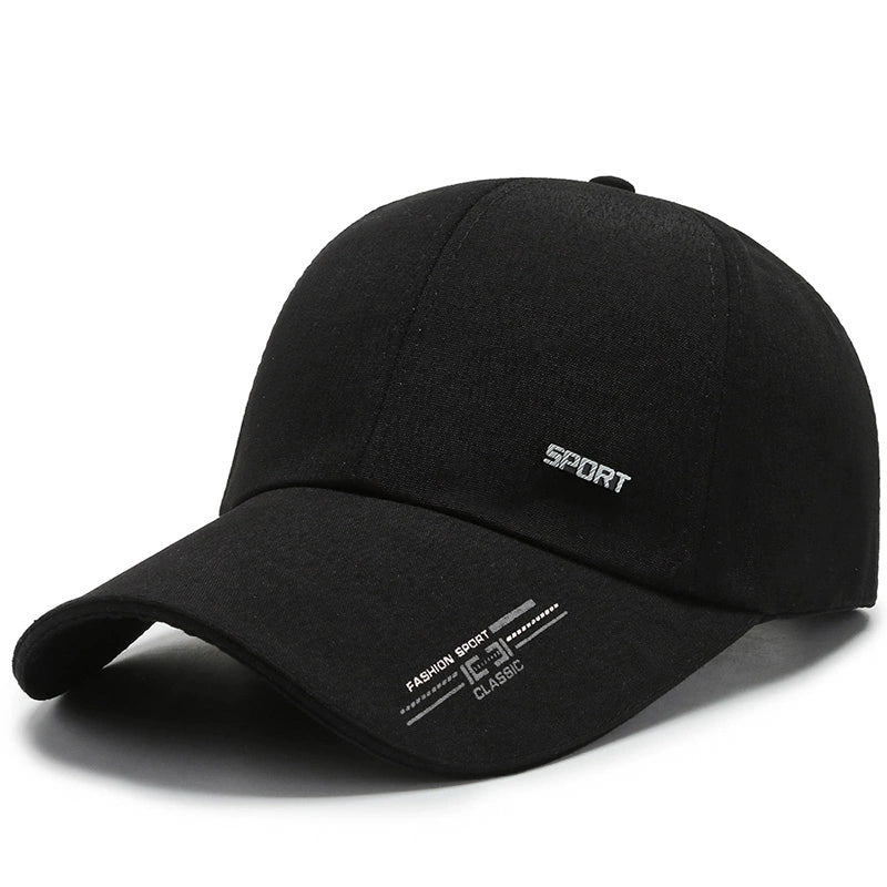 Black sport baseball cap with white embroidery and curved brim on white background