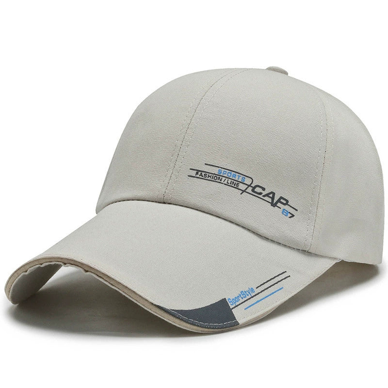 Beige sports baseball cap with curved brim and minimal graphic text design