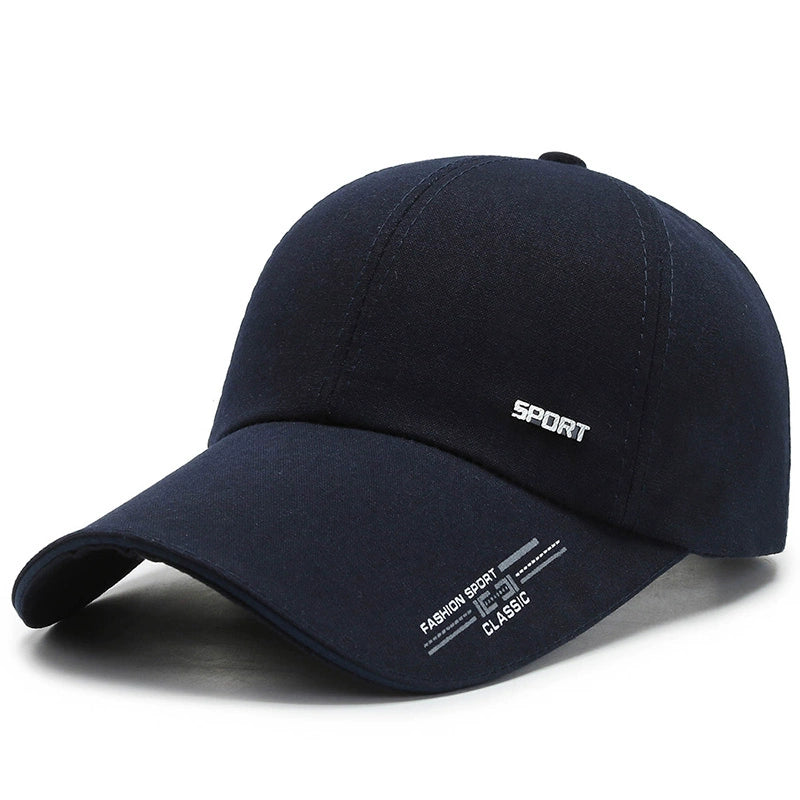 Navy blue baseball cap with 'SPORT' and 'FASHION SPORT CLASSIC' text, curved brim