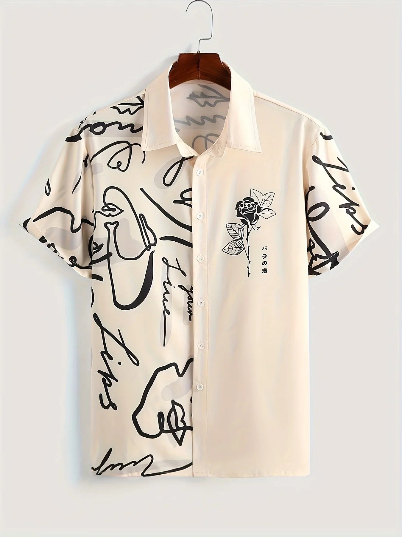 Beige short sleeve button-up shirt with black abstract face and rose line art print
