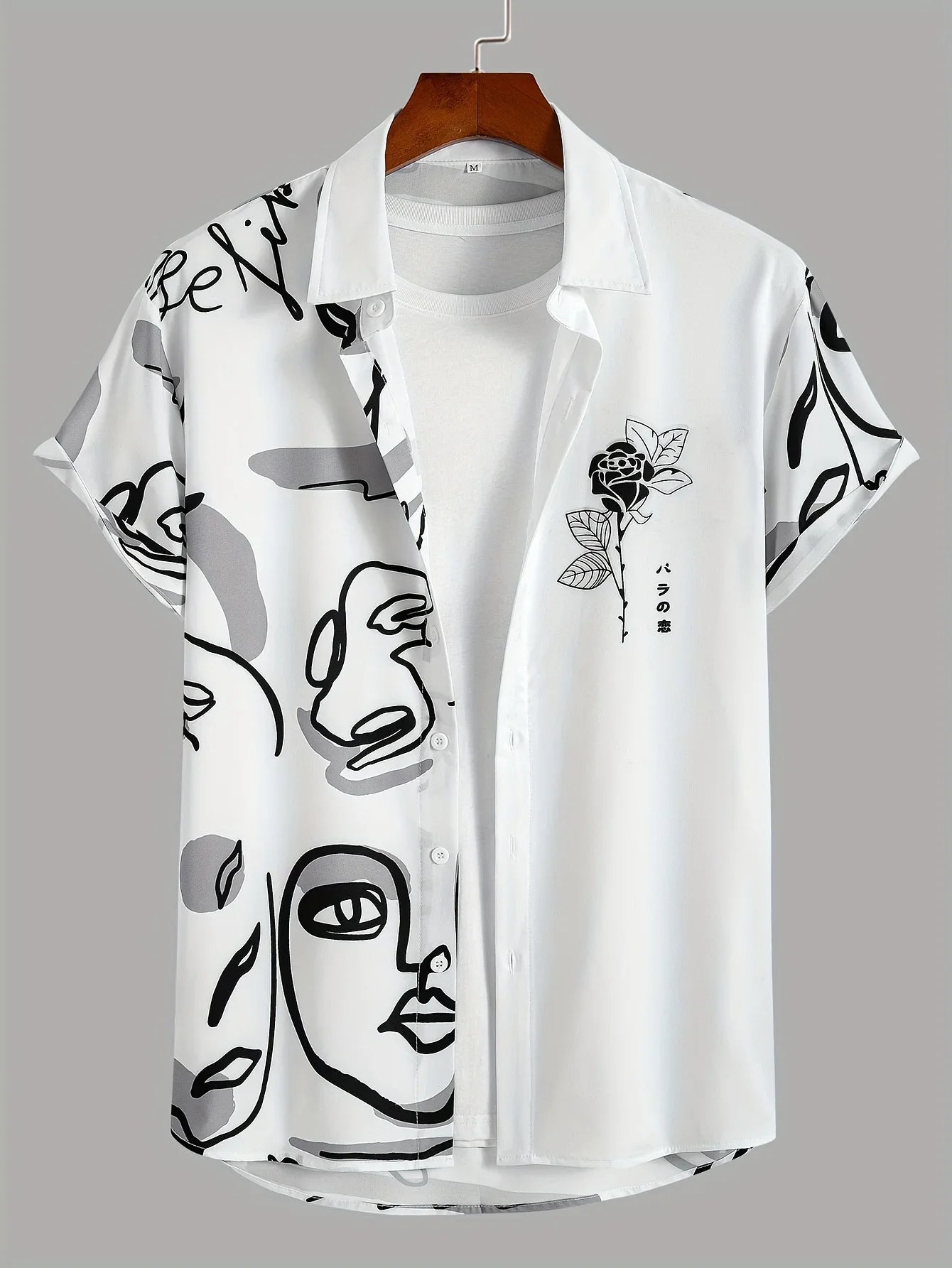 White short sleeve button-up shirt with abstract face and rose print, layered over plain tee