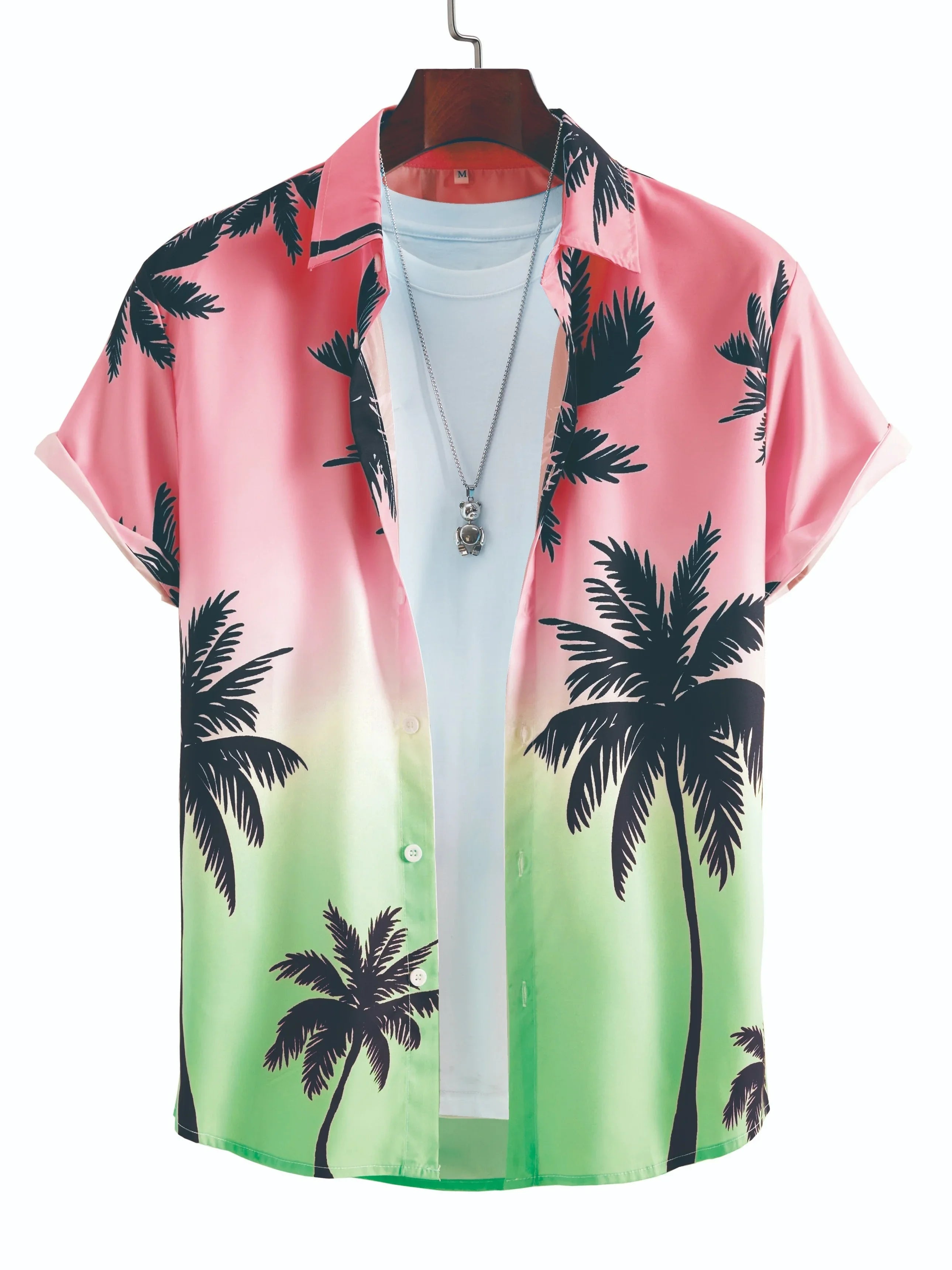Pink and green gradient tropical shirt with black palm tree print, white tee, and necklace