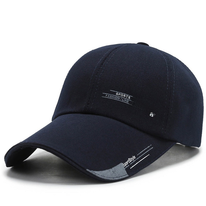 Black sports baseball cap with 'SPORTS FASHION LINE' text and curved brim, modern design
