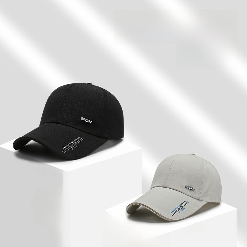 Black and gray baseball caps with sport embroidery displayed on white cubes