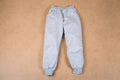 Children's grey sweatpants with elastic cuffs on a neutral background